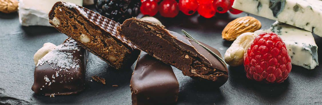 Close-up of gourmet chocolate molded into shell and seahorse shapes